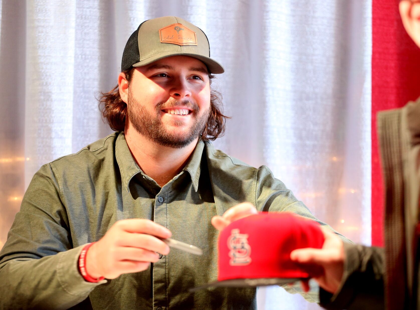 St. Louis Cardinals outfielder Alec Burleson signs autographs